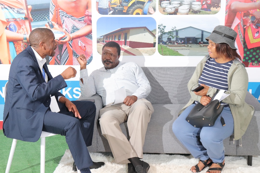 MTAD stall hosts in conversation with visitors